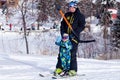 Russia, Sheregesh 2018.11.17 Adult skier and child in profession