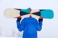 Russia, Sheregesh 2018.11.18 Professional man snowboarder in bright blue sportswear and outfit in snowy sunny high mountains. Con