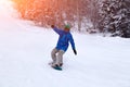 Russia, Shoriya 2018.11.18 Professional snowboarder in bright sp