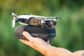 Russia, Sinyavskoe: August 20, 2018: DJI Mavic Air drone ready to start from case in men hand. Smallest modern foldable drone with