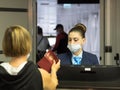 Russia, Sochi 02.11.2021. An airport worker checks passengers' documents and lets them board the plane