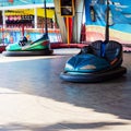 Russia, Sochi 15.02.2021. A blue and green small empty car on the marble floor. Children's circuit in an amusement park