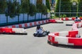 Russia, Sochi 14.05.2022. A child in a helmet on a kart rides on a karting track. Racing for kids. Entertainment and Royalty Free Stock Photo