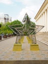 Russia, Sochi 07.07.2020. Decorative installation in the form of a row of stars with garlands on the square in front of