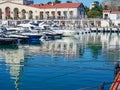Russia Sochi 16.04.2022. Fishing at the marina near the yachts. Many private yachts in the seaport. South sea pier with Royalty Free Stock Photo