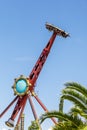 Russia, Sochi 14.05.2022. A giant amusement ride in the form of a pendulum rotating around its axis turns people upside