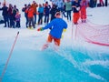 Russia, Sochi 11.05.2019. A guy snowboarder drove the pool to the end and at the finish he is photographed by spectators