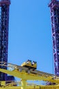 Russia, Sochi 14.05.2022. People ride on a fun extreme attraction in an amusement park on a sunny day. Family holidays