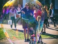 Russia, Sochi 03.09.2020. People watch a big soap bubble on the street