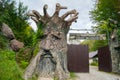 Russia, Sochi. September 2019. Tourist village Paradise delight. At the entrance to the park area - a huge tree with the face of a
