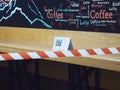 Russia, Sochi 02.11.2021. A sign with the inscription covid-19 free zone stands on a wooden counter of a cafe with a