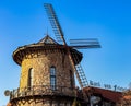 Russia, St. Petersburg - April 28, 2023: Stone tower with a mill in the German style against the sky