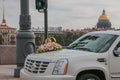 Russia, St. Petersburg, city streets, road transport, wedding car close-up, in the background the golden dome of St. Isaac`s Cathe Royalty Free Stock Photo