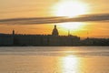 Russia, St. Petersburg, early morning on the Neva River, bright golden sunrise with a view of St. Isaac`s Cathedral. A warm, sensu