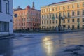 Russia, St. Petersburg, early summer morning on the street of the city, the reflection of the sun on the wet asphalt, yellow and p