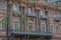 Russia, St. Petersburg, elements of architecture close-up, building house close-up, beautiful stucco balconies, columns. Pink buil