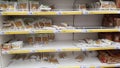 Half-empty shelves with pasta due to coronovirus in a supermarket