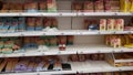 Half-empty shelves with pasta due to coronovirus in a supermarket