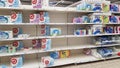 Half empty shelves with toilet paper due to coronovirus in a supermarket