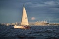 Russia, St. Petersburg, 23 July 2021: Competition of sailboats on the horizon in sea at sunset, the amazing storm sky of