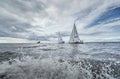Russia, St. Petersburg, 23 July 2021: Competition of sailboats in regatta at storm weather, race, big waves, sail