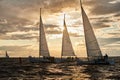 Russia, St.Petersburg, 23 July 2021: Competition of Three sailboats on the horizon in sea at sunset, the amazing storm