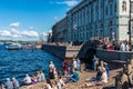 Russia, St. Petersburg, July 2020. People on a small beach near the Hermitage in the city center.