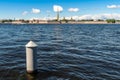 Russia, St. Petersburg, July 2020. Seagull on an iron pillar and a view of the old fortress.
