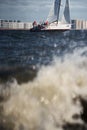 Russia, St.Petersburg, 07 July 2023: The view through the spray of how the sailboat is heeling at sunset, boat roll