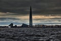 Russia, St. Petersburg, 17 June 2022: Stormy sky over the skyscraper Lakhta center of the gas company Gazprom at dusk