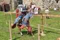 Knight on horseback in military armor at the knightly tournament on the reconstruction