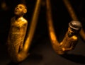 Russia, St. Petersburg - March 10, 2023: Golden figurines of men in the Museum of Ancient Egypt