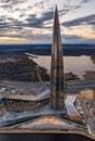 Russia, St.Petersburg, 06 May 2020: Aerial panoramic image of skyscraper Lakhta center at sunset, night illumination is