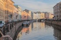 Russia, St. Petersburg, the Moika River in the morning, beautiful buildings in delicate pink and blue tones, magnificent reflectio