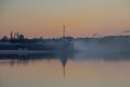 Russia, St. Petersburg, Neva River embankment in summer. View of the sights of the city. A gentle dawn morning. Light fog over the