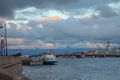 Russia, St. Petersburg, the Neva River in summer. Berth, tourist ship, textured post-storm sky, blue blue color. In the background Royalty Free Stock Photo