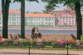 Russia, St. Petersburg. People couple on the Neva embankment on the background of the city, people in the city, sights, urban land