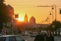 Russia, St. Petersburg. People couple at sunset on the background of the city, people in the city, orange sky, lanterns, urban lan