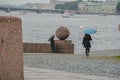 Russia, St. Petersburg, a rainy summer day, the arrow of Vasilievsky Island, architectural elements, the Neva River, a girl with a