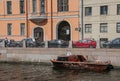 Russia, St. Petersburg, rivers and canals of the city, water, a small boat, a bright sunny summer day