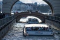 Russia, St. Petersburg - September 10, 2023: Pleasure boats with tourists follow the Winter Canal