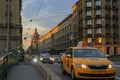 Russia, St. Petersburg, street road busy traffic, yellow taxi, Summer evening lighting.