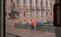 Russia, St. Petersburg in the summer in the rain. A rainy gray cloudy city. View of the sights. Nevsky Prospekt, Anichkov Bridge,