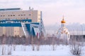 Surgut University and the Church of the Holy Martyr Tatiana in the winter frosty morning
