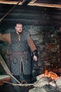 A blacksmith in a medieval forge, Historical reconstruction of the Viking village Svargas