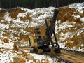 17.03.2012, Russia, Sverdlovsk region, Toshim bauxite mine - Voronezh crawler track excavator at the bottom of the