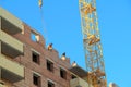 22-02-2020 Russia Syktyvkar. Construction workers work at a construction site building a residential brick house, laying bricks on Royalty Free Stock Photo