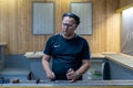 Russia, Tatarstan, June 23, 2019. A man in a black T-shirt charges the pistol holder with 9 19 cartridges. man`s hands loading a