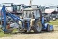 Tractor, standing in a row. Agricultural machinery. Royalty Free Stock Photo