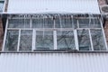 Russia. Terrible huge icicles formed on the balcony of a multi-storey building Royalty Free Stock Photo